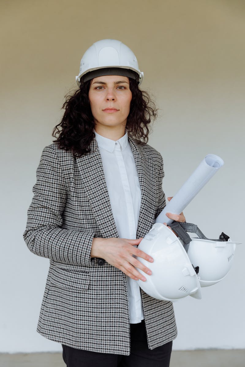 Woman in a Blazer Wearing a Safety Helmet