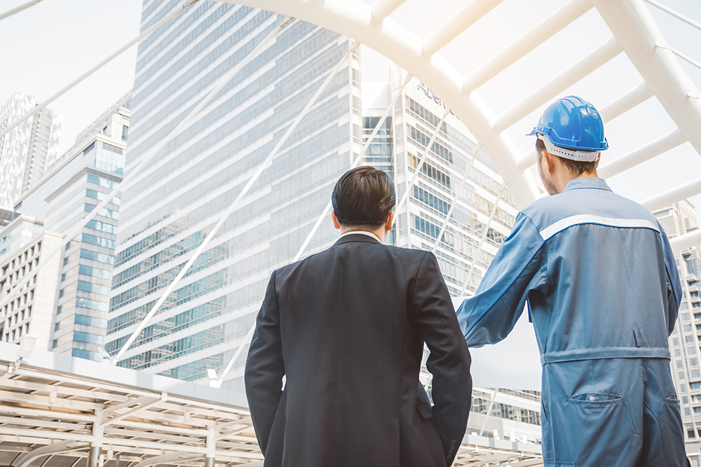 business manager and engineer meeting project at construction site